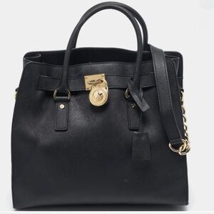 MICHAEL Michael Kors Black and Gold Satchel with Elegant Design